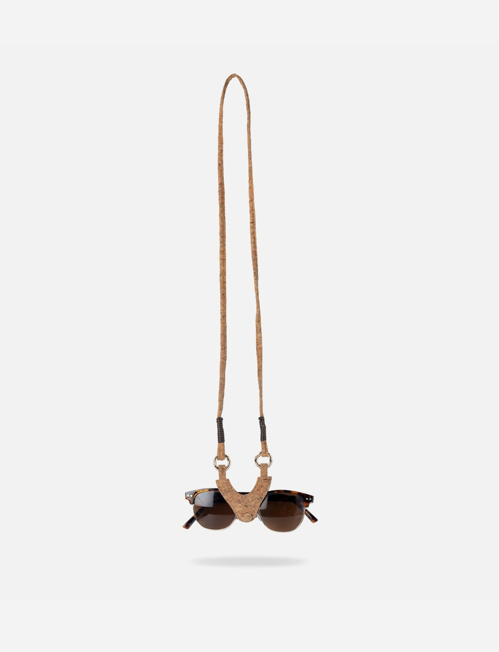 Econock Austere sunglass holder with cork and leather, featuring a lanyard for secure eyewear storage and easy access.