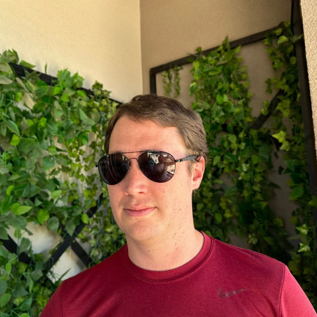 Papago ebony wood Palomas sunglasses with dark lenses and sleek frame, showcasing elegant natural wood grain design.