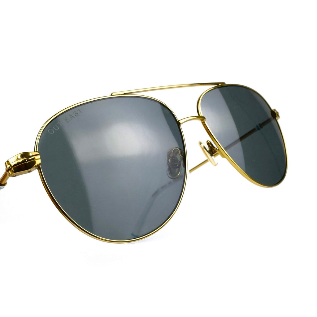 Out East Eyewear GANSETT sunglasses with black frames and dark tinted lenses on a neutral background