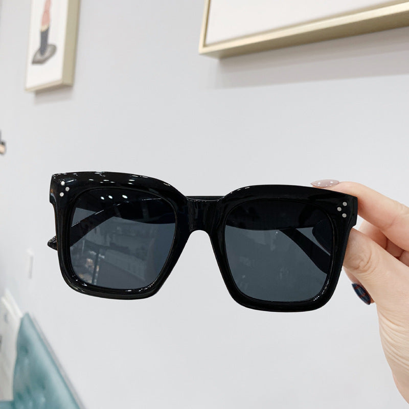 Retro square UV400 sunglasses by RAMODO JEWELRY with black frames and dark tinted lenses, stylish and protective eyewear.