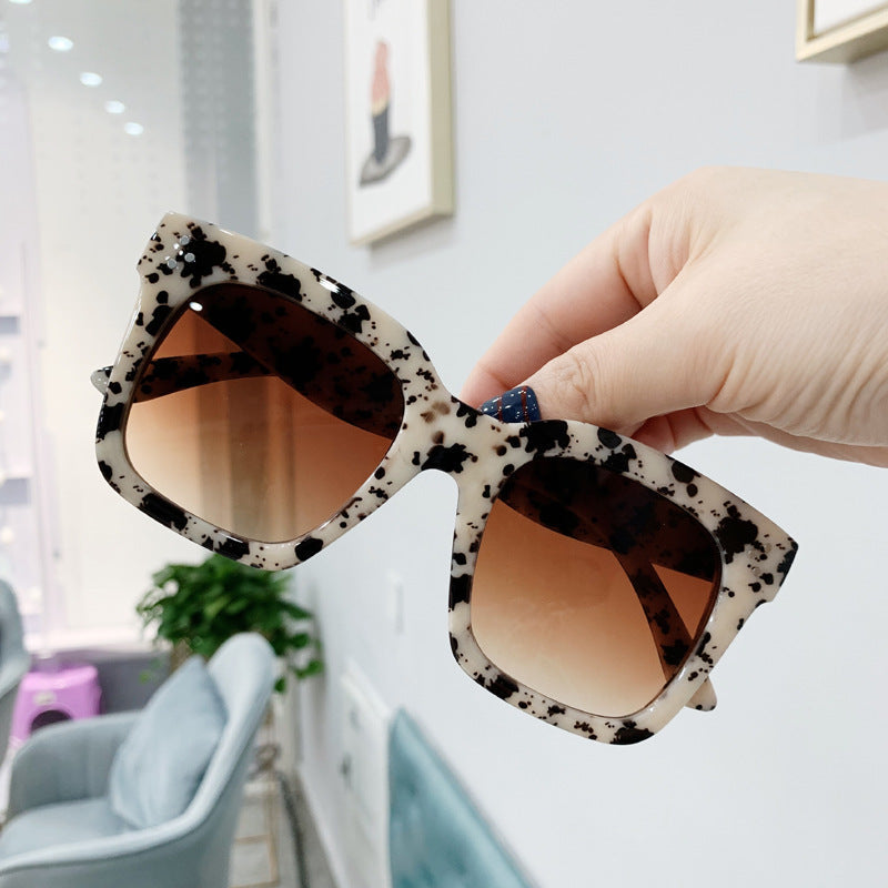 Retro square UV400 sunglasses by RAMODO JEWELRY with black frames and tinted lenses, perfect for stylish sun protection.