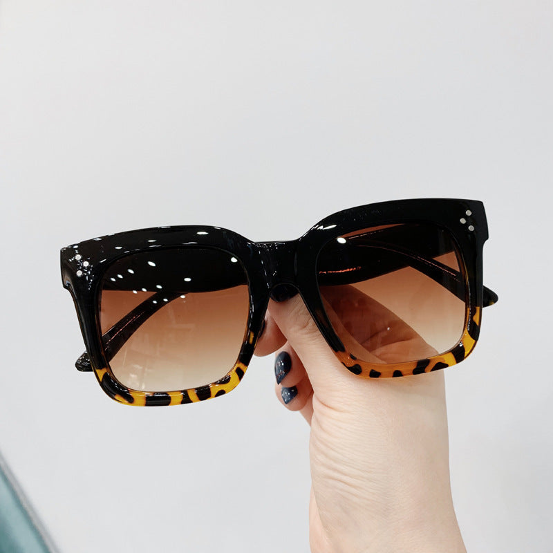 Retro square UV400 sunglasses by RAMODO JEWELRY with black frames and dark tinted lenses for stylish sun protection.