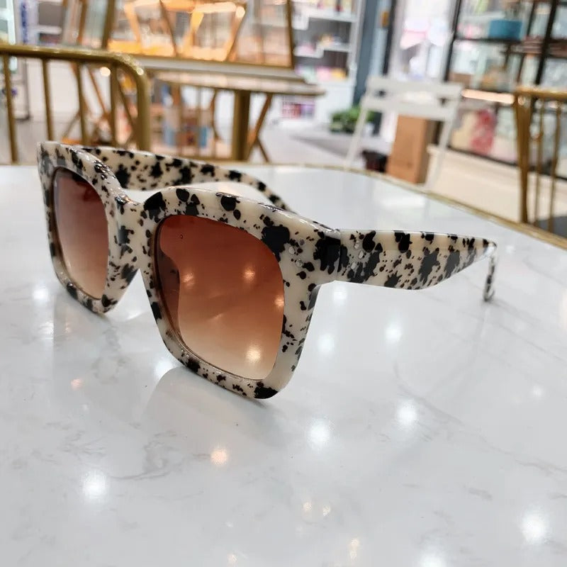 Retro square UV400 sunglasses by RAMODO JEWELRY with dark tinted lenses and bold frames, stylish eyewear for sun protection.
