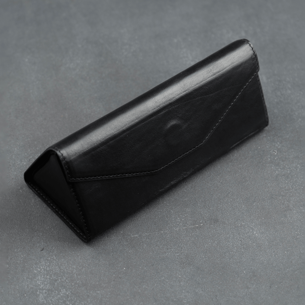 Black luxury leather sunglasses case by LEATHERE, designed for eyewear accessories, with a sleek and stylish appearance.
