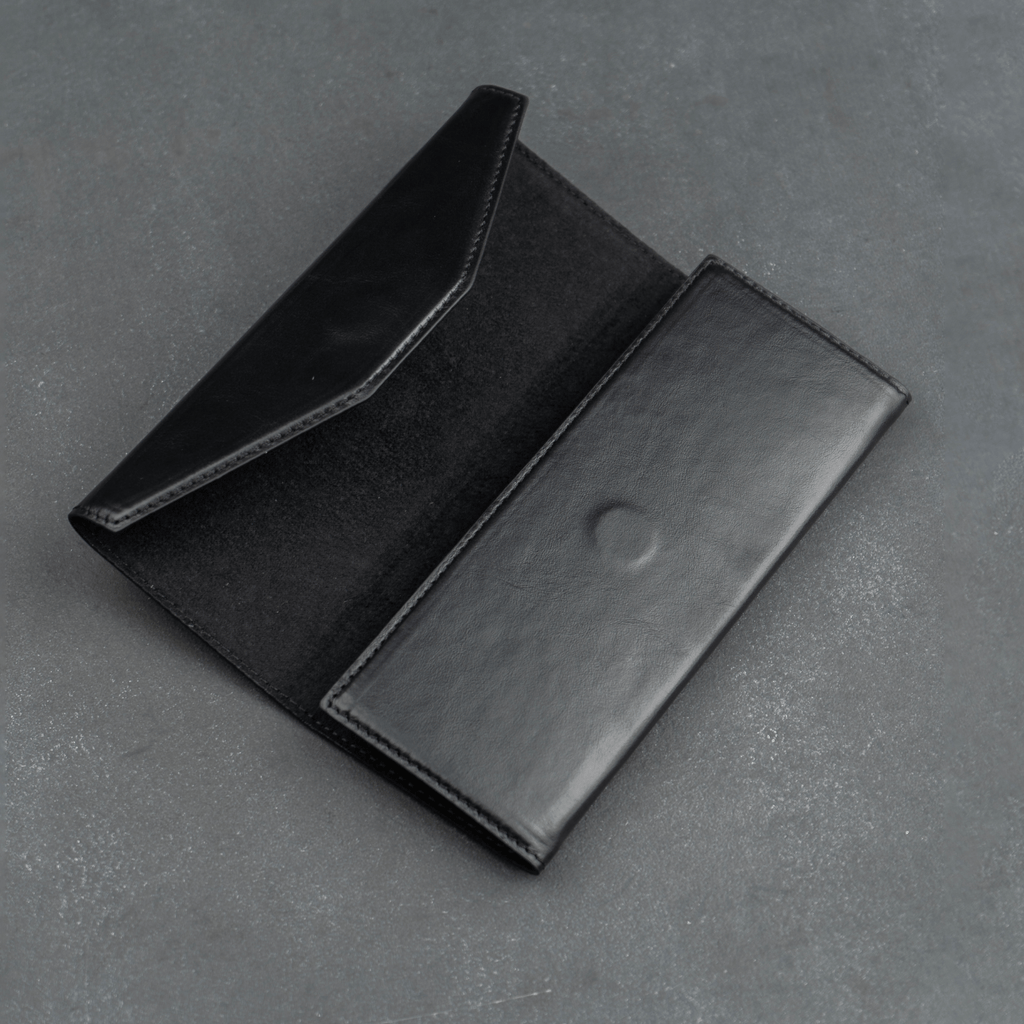 Black luxury leather sunglasses case by LEATHERE for eyewear accessories, designed to protect and stylishly store sunglasses.