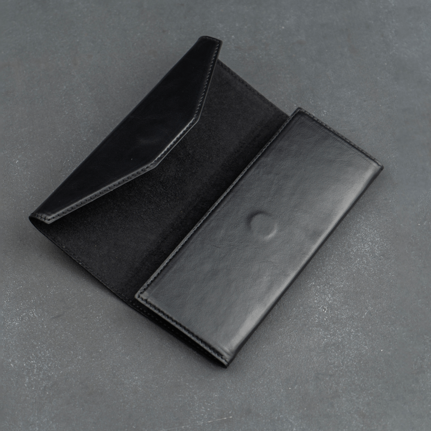 Black luxury leather sunglasses case by LEATHERE for eyewear accessories, designed to protect and stylishly store sunglasses.