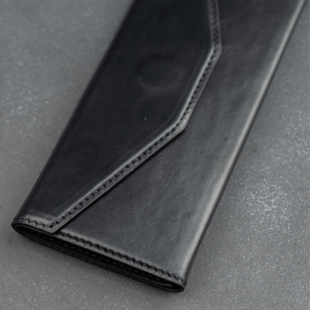 Black luxury leather sunglasses case by LEATHERE, designed as a stylish eyewear accessory for protecting sunglasses.