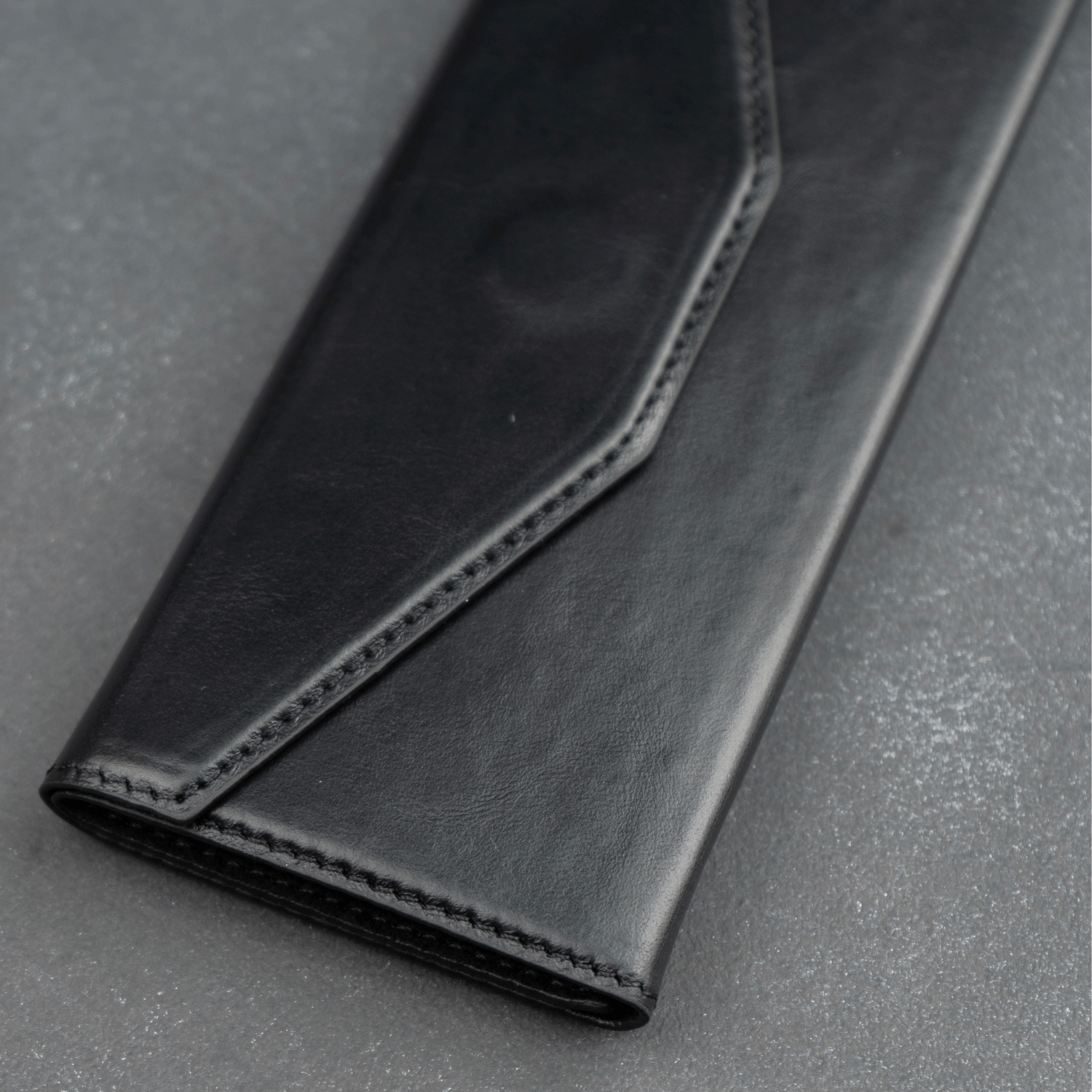 Black luxury leather sunglasses case by LEATHERE, designed as a stylish eyewear accessory for protecting sunglasses.