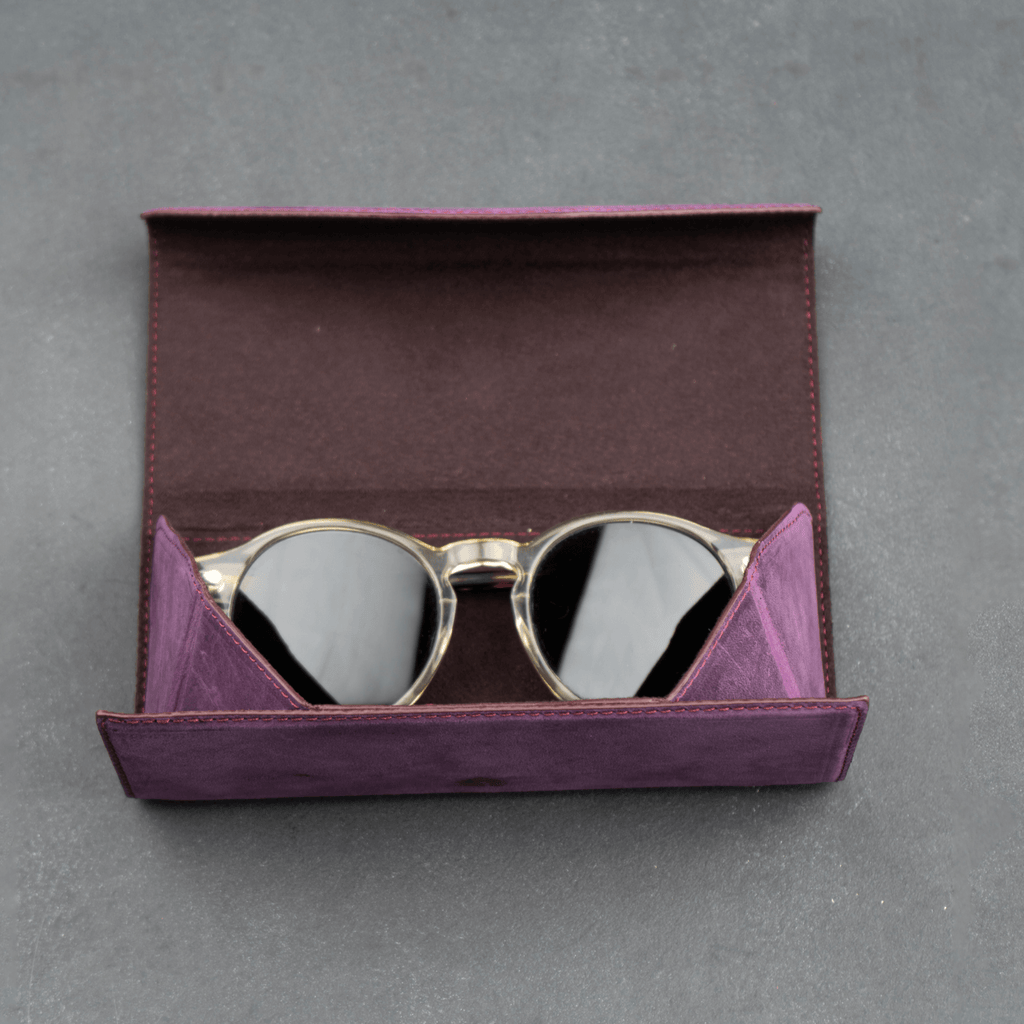 Purple LEATHERE luxury leather sunglasses case, stylish eyewear accessory with soft interior protection.