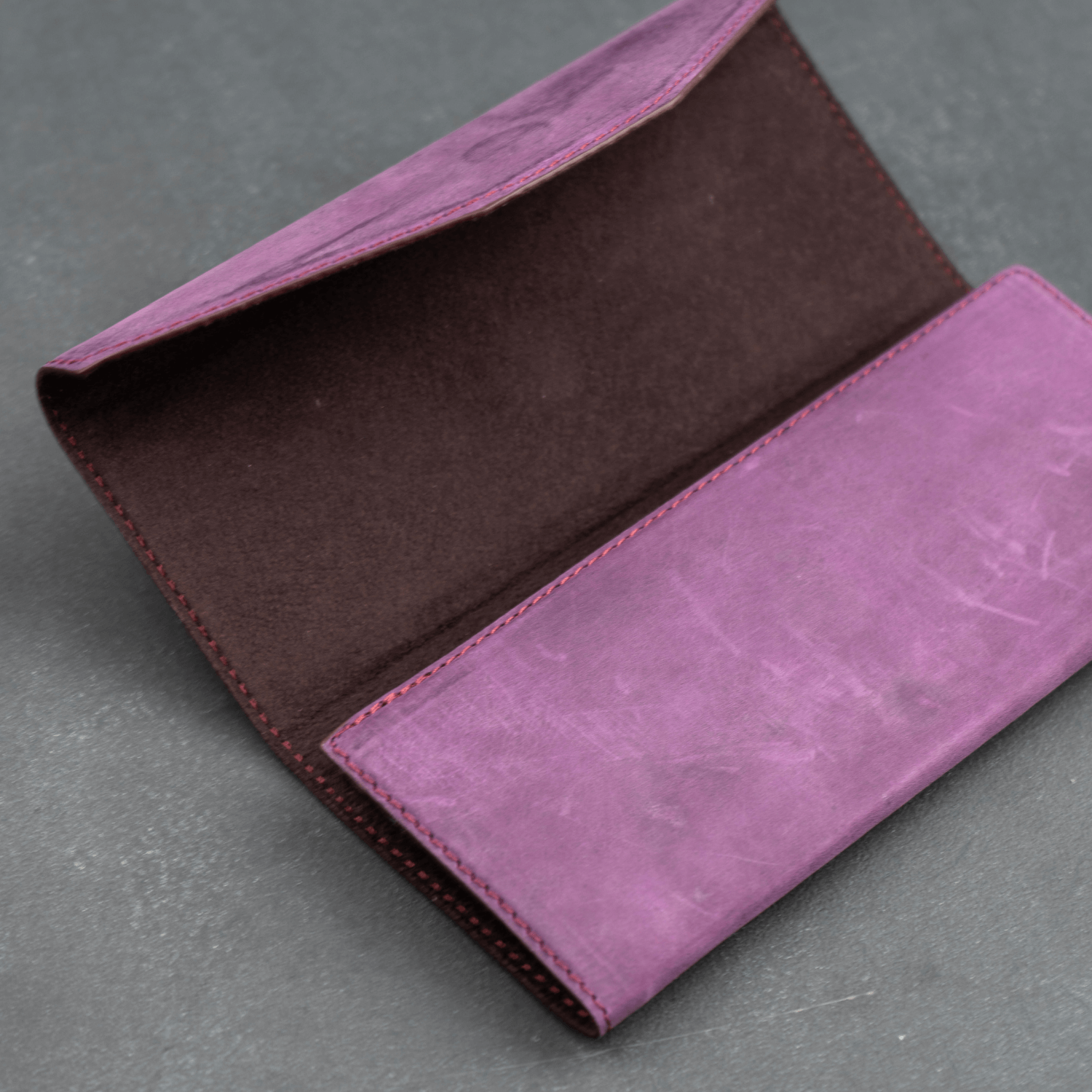Purple luxury leather sunglasses case by LEATHERE, stylish eyewear accessory designed to protect and store sunglasses.