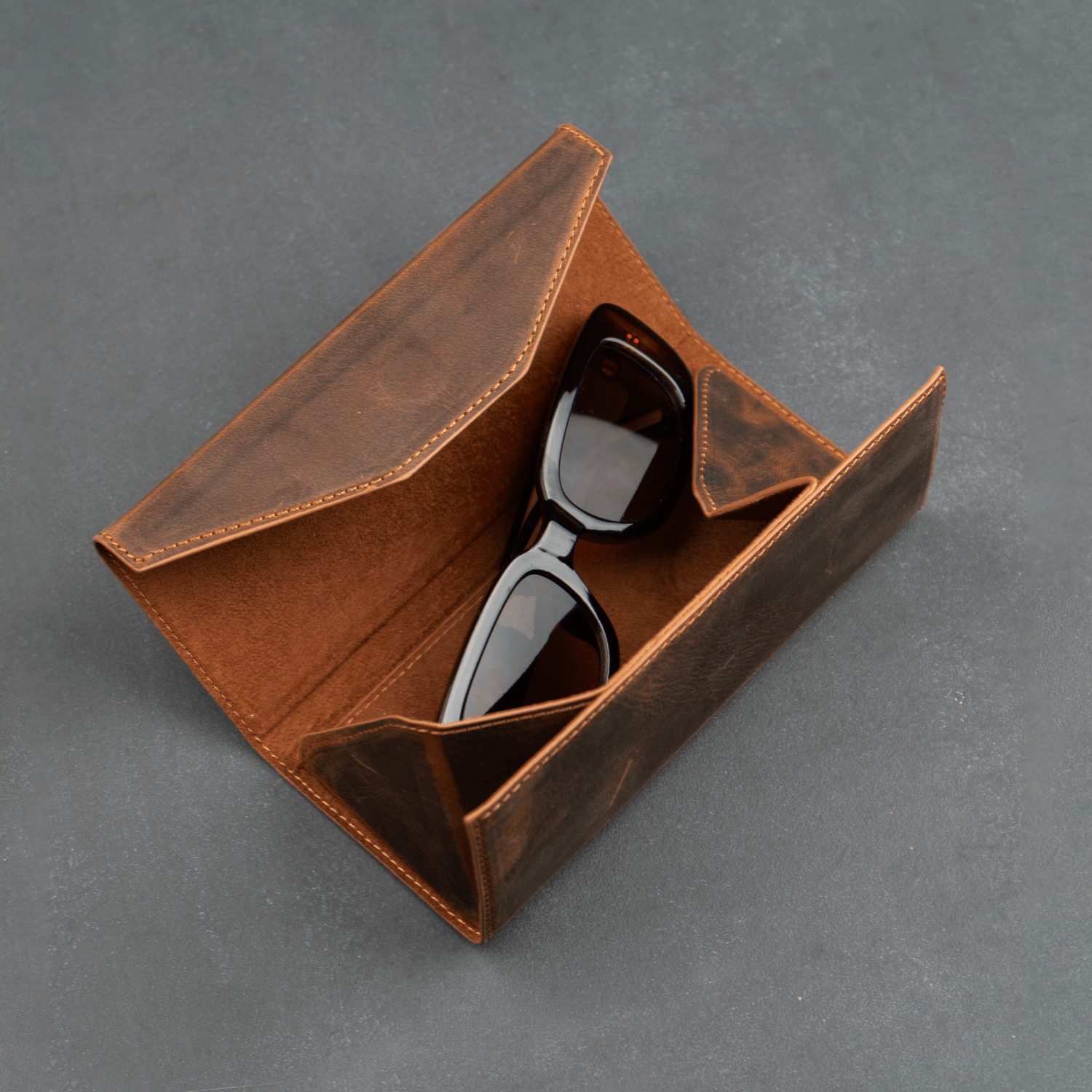 Dark brown luxury leather sunglasses case by LEATHERE, designed for eyewear accessories with elegant craftsmanship.