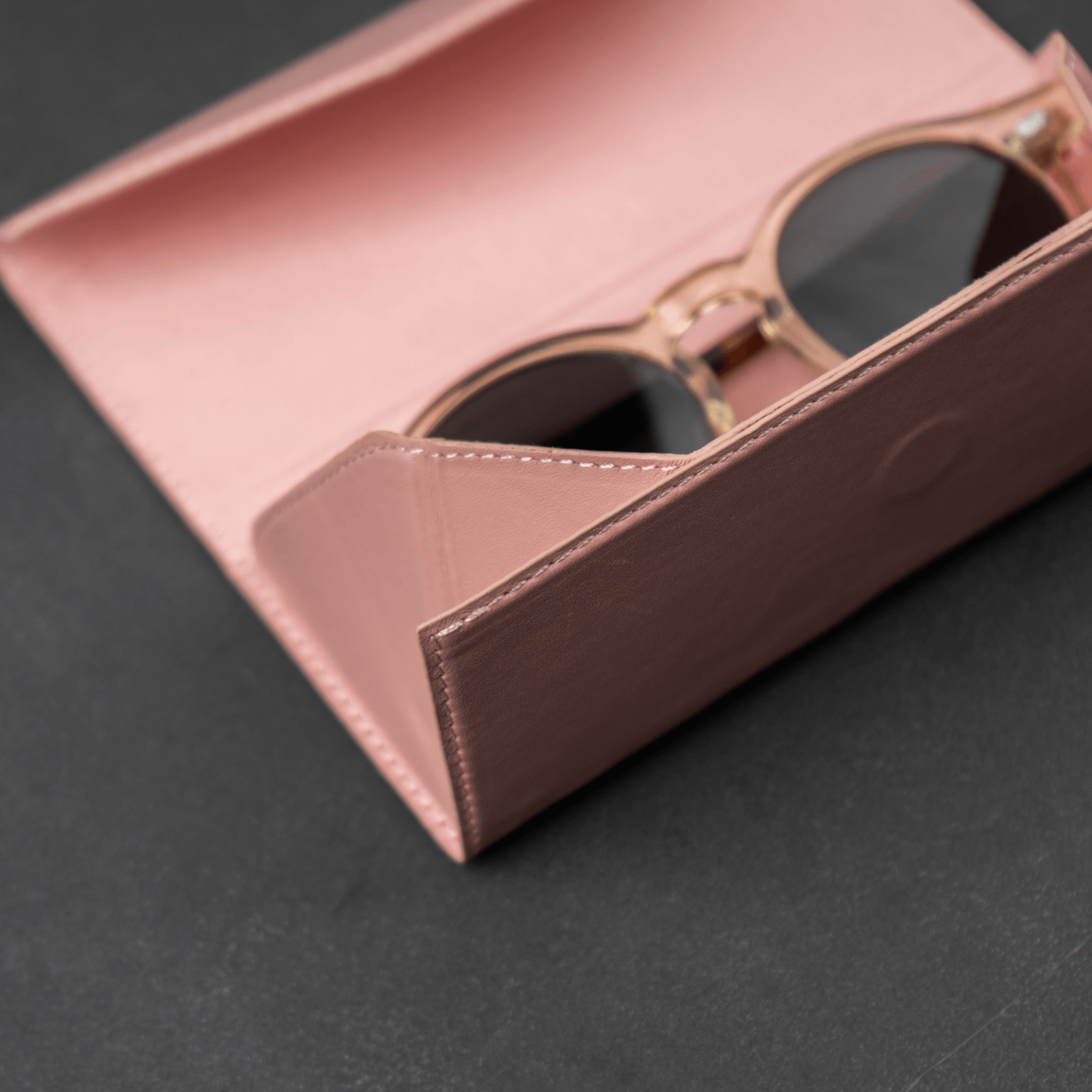 Pink luxury leather sunglasses case by LEATHERE, stylish eyewear accessory with soft interior for protection.