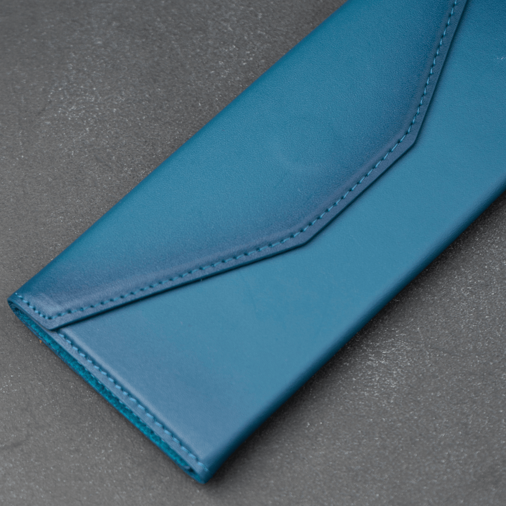 Dark blue luxury leather sunglasses case by LEATHERE, designed for eyewear accessories, with a sleek and stylish appearance.