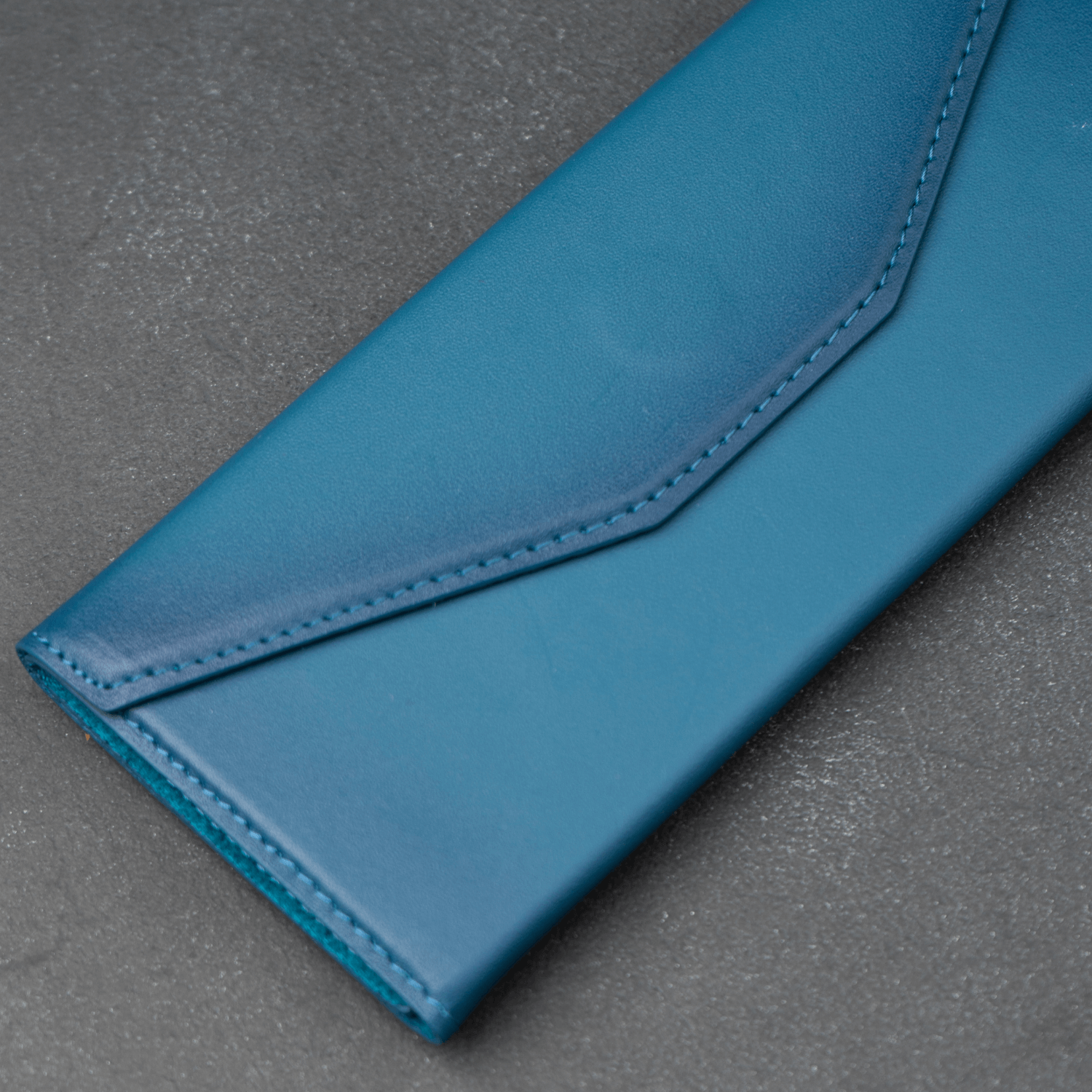 Dark blue luxury leather sunglasses case by LEATHERE, designed for eyewear accessories, with a sleek and stylish appearance.