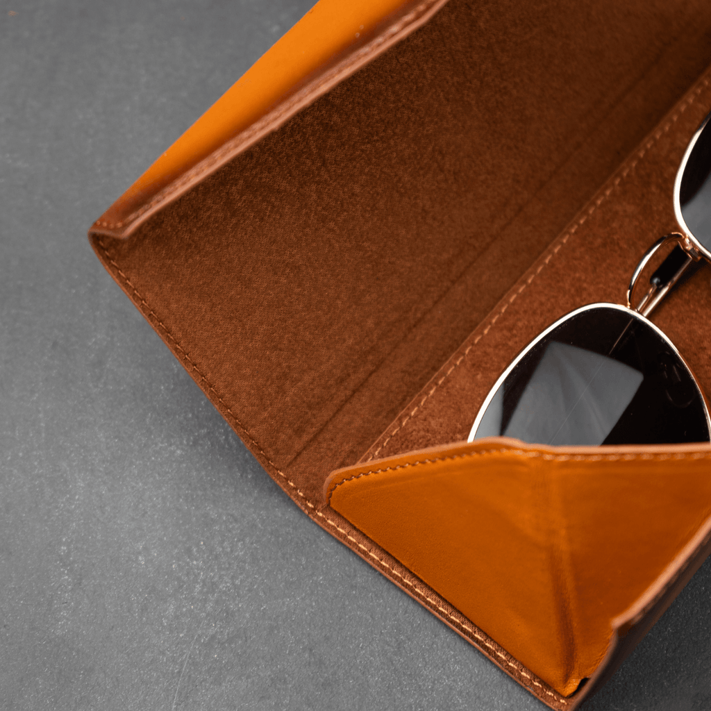 Rustic brown LEATHERE luxury leather sunglasses case for eyewear accessories, showcasing a sleek, stylish design.