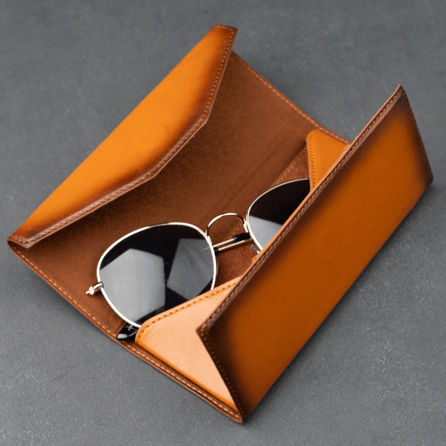 Rustic brown leather sunglasses case by LEATHERE, stylish eyewear accessory with classic design for protecting glasses.