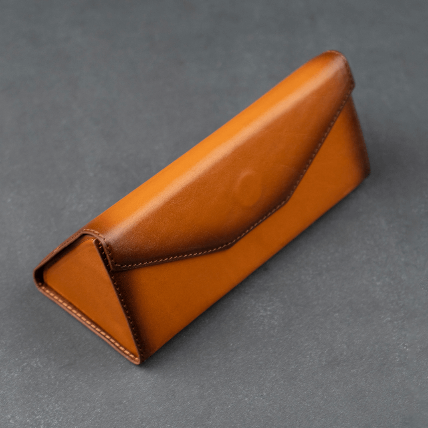 Rustic brown leather sunglasses case by LEATHERE, stylish eyewear accessory with soft interior for protection.