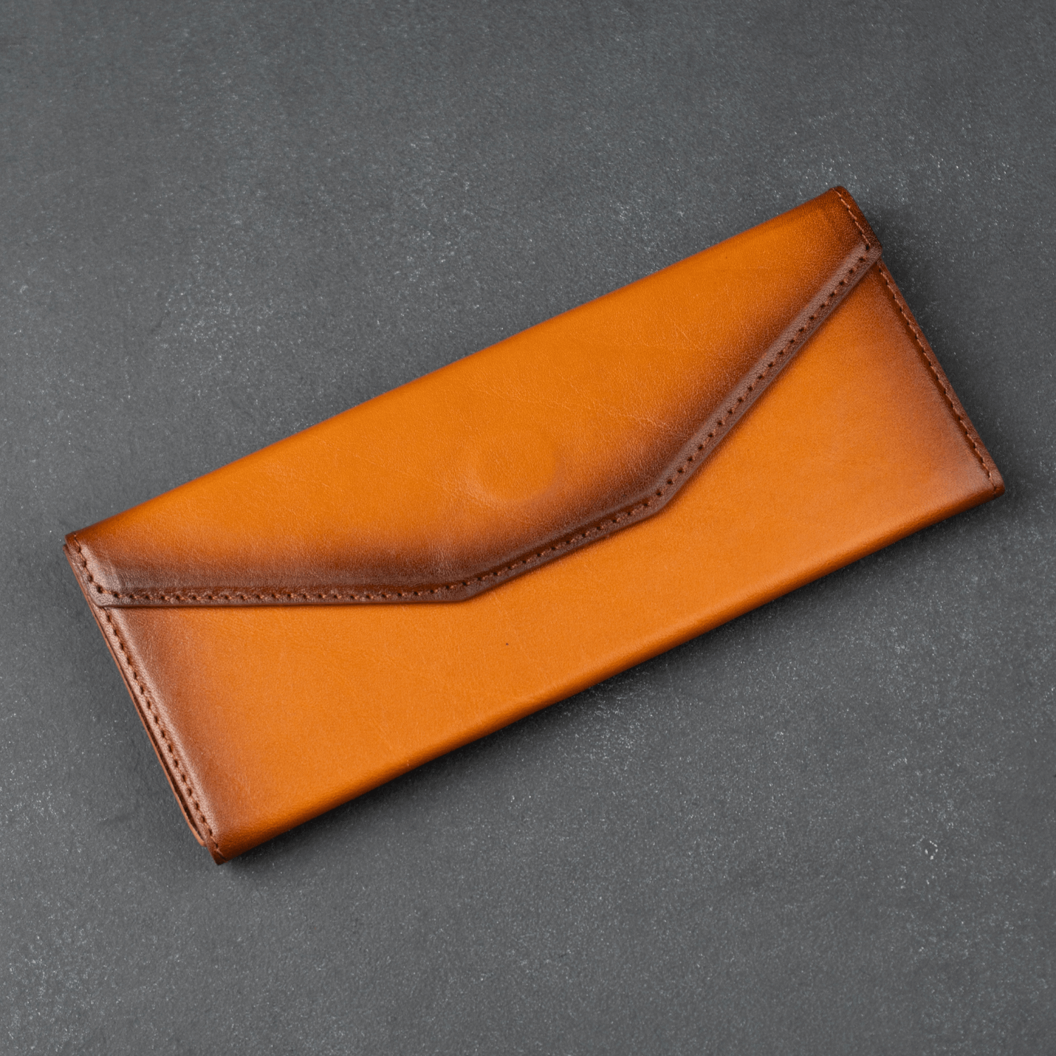 Rustic brown LEATHERE luxury leather sunglasses case for eyewear accessories, with a sleek and durable design.