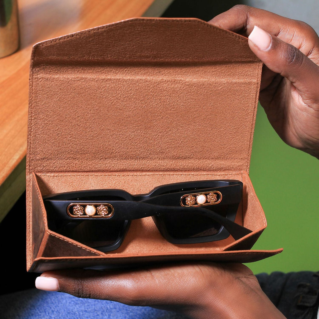 Dark brown luxury leather sunglasses case by LEATHERE, designed as an elegant eyewear accessory with a soft interior.