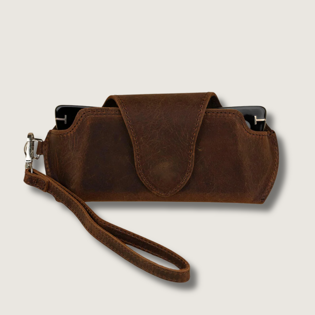 Dark brown leather sunglass case with wrist strap from LEATHERE, designed for eyewear protection and easy carrying.