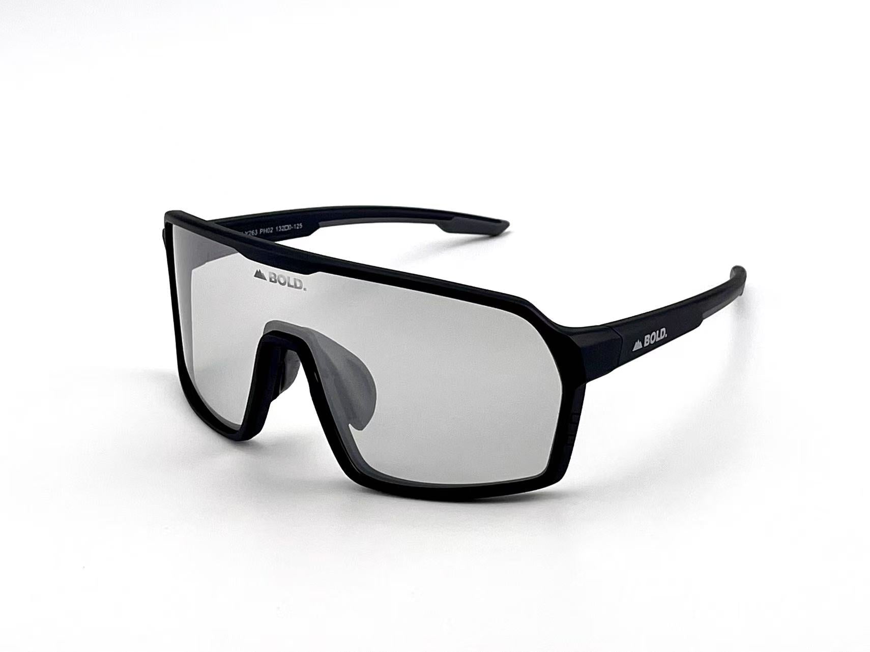 Boldouterwear Drift photochromic sunglasses with tinted lenses, outdoor eyewear showcasing sleek black frames and adjustable nose pads.