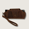 Rich dark brown leather sunglass case with wrist strap by LEATHERE, designed for stylish eyewear protection and easy carrying.