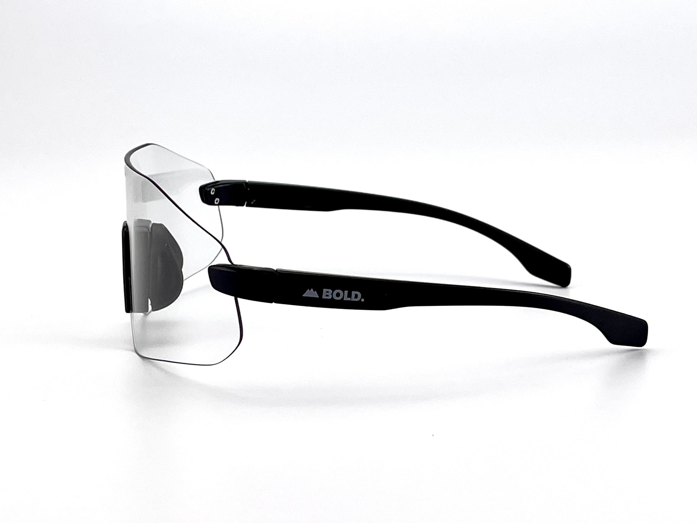 Boldouterwear BOLD Emerald photochromic sunglasses with green-tinted lenses and sleek outdoor eyewear design.