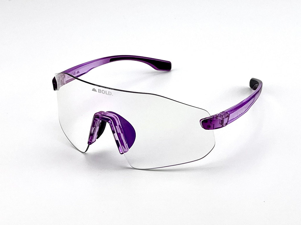 Boldouterwear BOLD Emerald photochromic sunglasses with green-tinted lenses and sleek frame, designed for outdoor use.