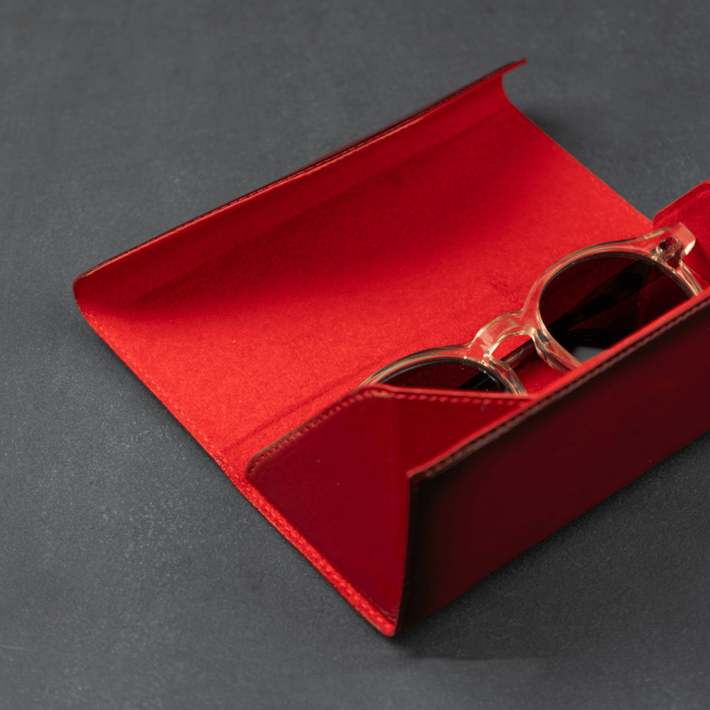 Red luxury leather sunglasses case by LEATHERE, designed for eyewear accessories, with a sleek and stylish appearance.