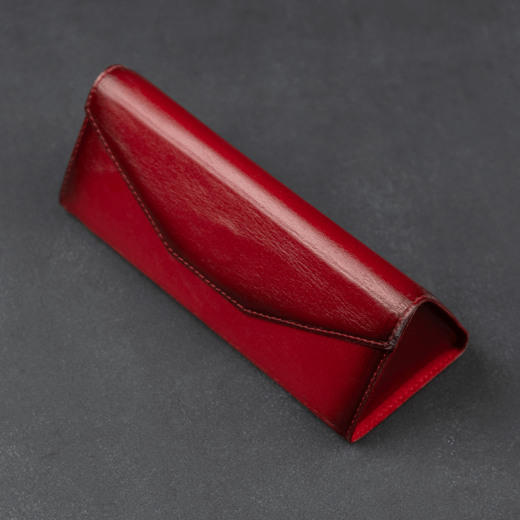 Red LEATHERE luxury leather sunglasses case, eyewear accessory with soft interior and sleek design for protection and style.