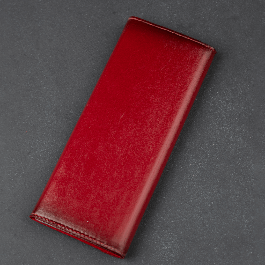 Red LEATHERE luxury leather sunglasses case for eyewear accessories, designed to protect and store sunglasses stylishly.