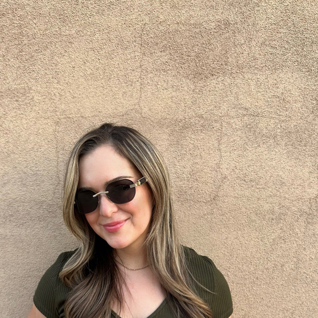 Papago Midnight Agassiz sunglasses with dark tinted lenses and sleek black frames, stylish eyewear for sunny days.