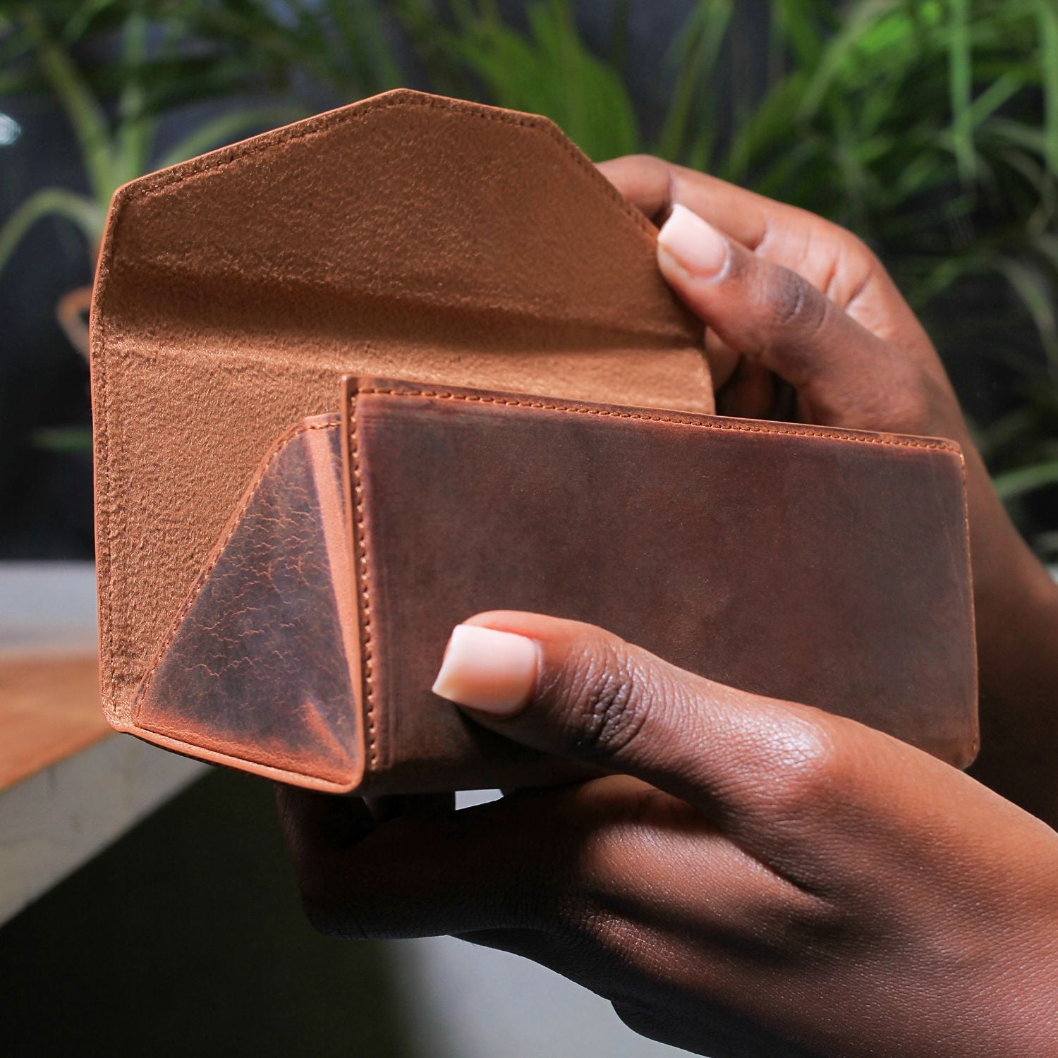 Dark brown LEATHERE luxury leather sunglasses case for eyewear accessories with sleek, stylish design.