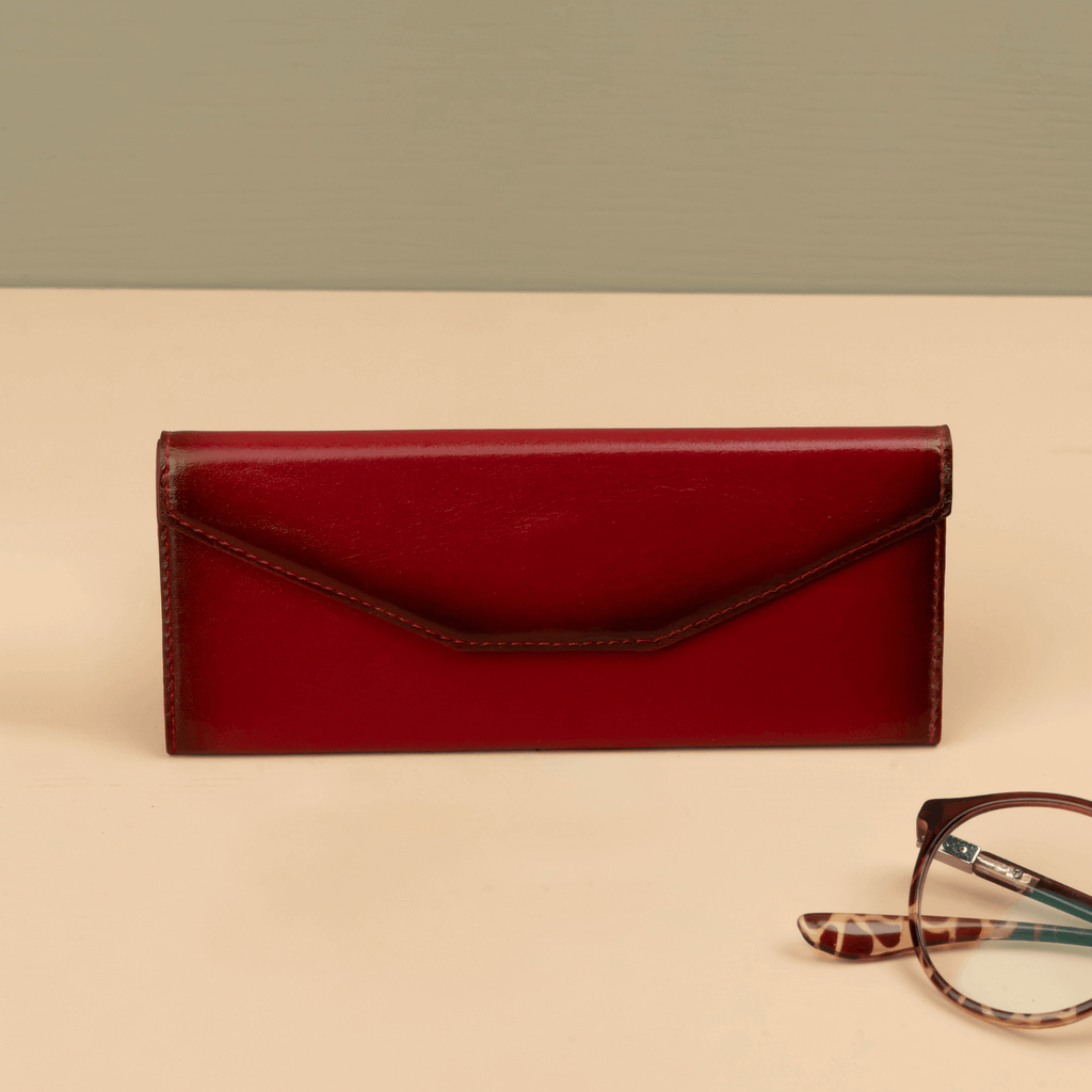 Red luxury leather sunglasses case from LEATHERE, designed for eyewear accessories, with a sleek and stylish appearance.