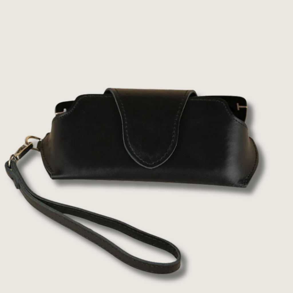 Black leather sunglass case with wrist strap from LEATHERE, designed for eyewear accessories and easy carrying.
