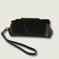 Black leather sunglass case with wrist strap from LEATHERE, designed for eyewear accessories and easy carrying.