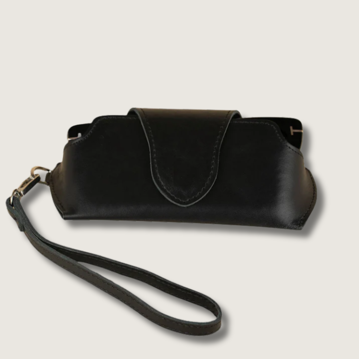 Black leather sunglass case with wrist strap from LEATHERE, designed for eyewear accessories and easy carrying.