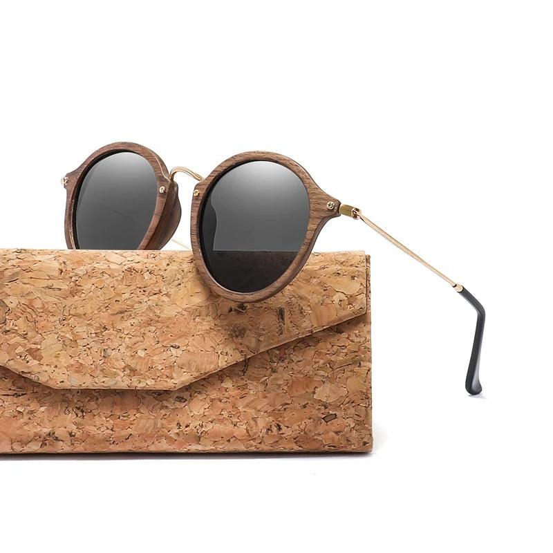 Stevvex modern ultralight unisex polarized wooden sunglasses with sleek design and tinted lenses reflecting light.