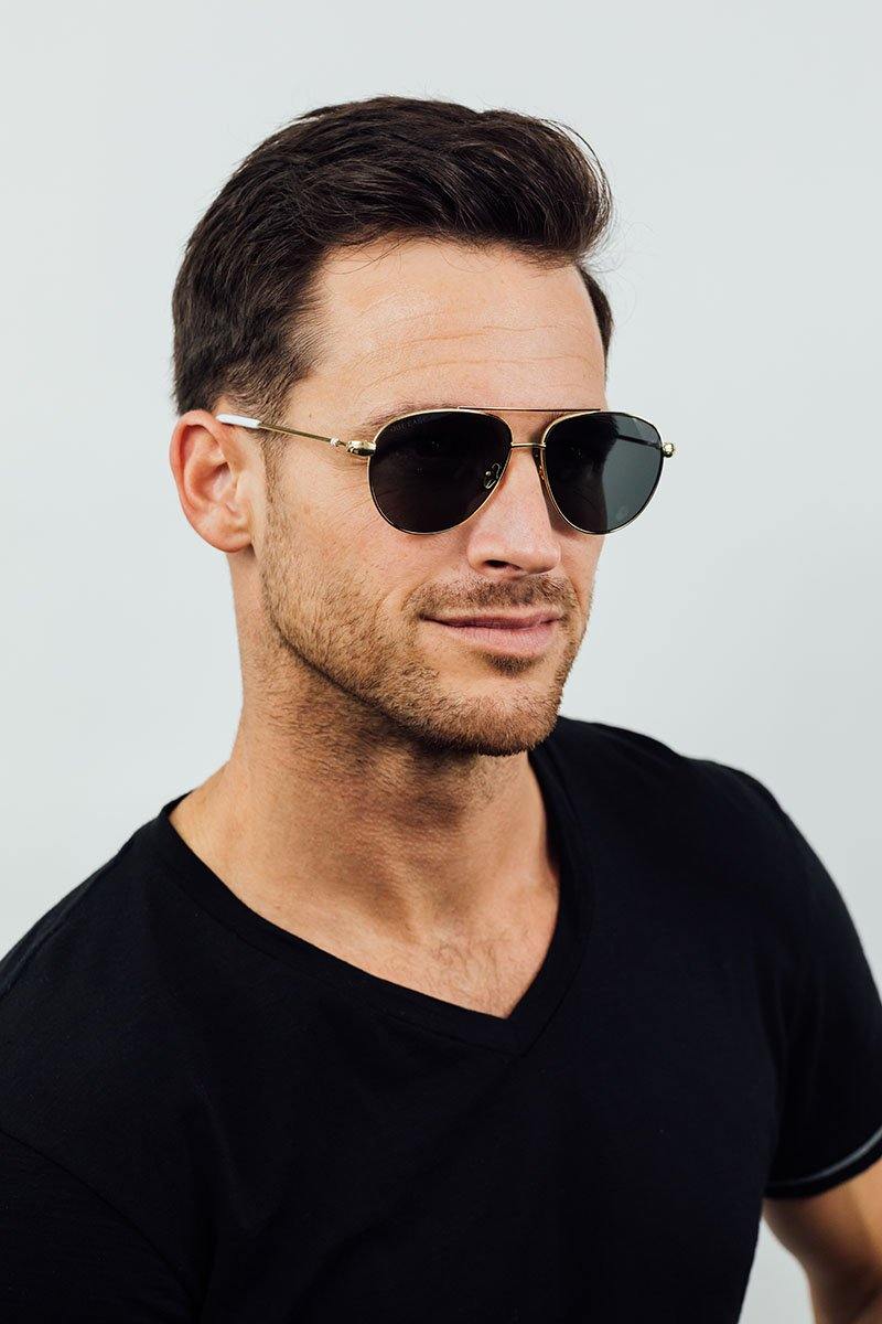Out East Eyewear Gansett sunglasses with round frames and tinted lenses, stylish accessories for sunny days.