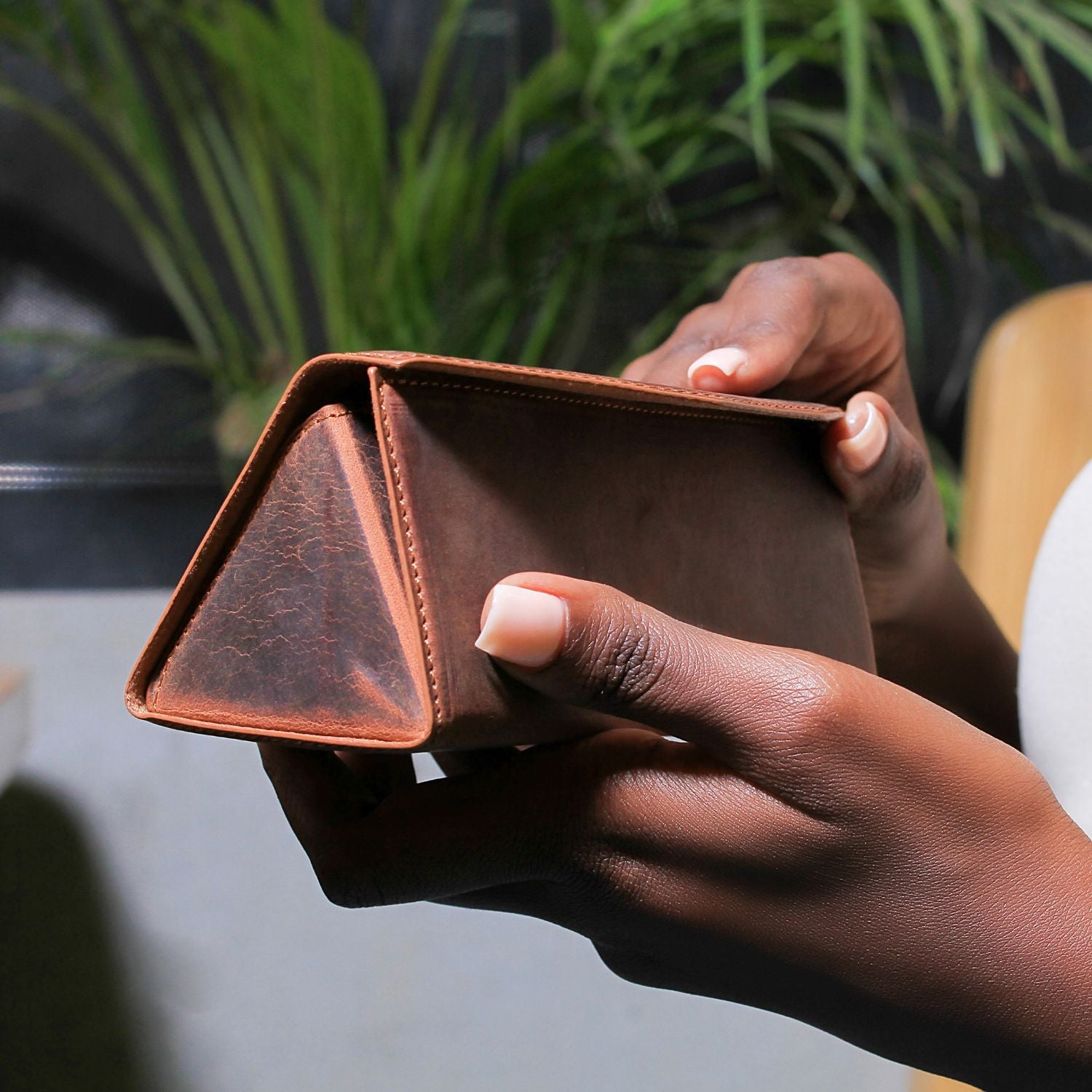 Dark brown luxury leather sunglasses case by LEATHERE for eyewear accessories, featuring a sleek and durable design.