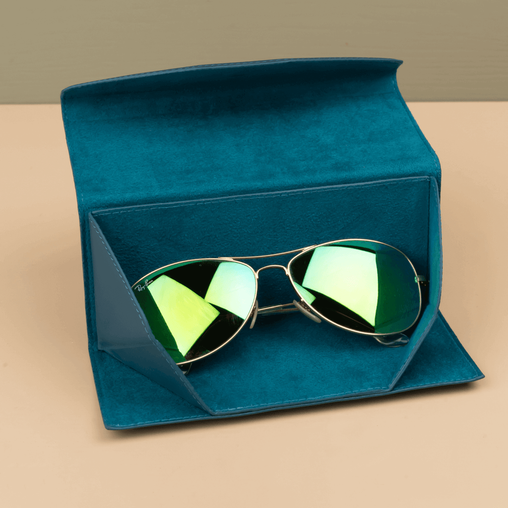 Dark blue leather sunglasses case by LEATHERE, luxury eyewear accessory with soft interior for protection.