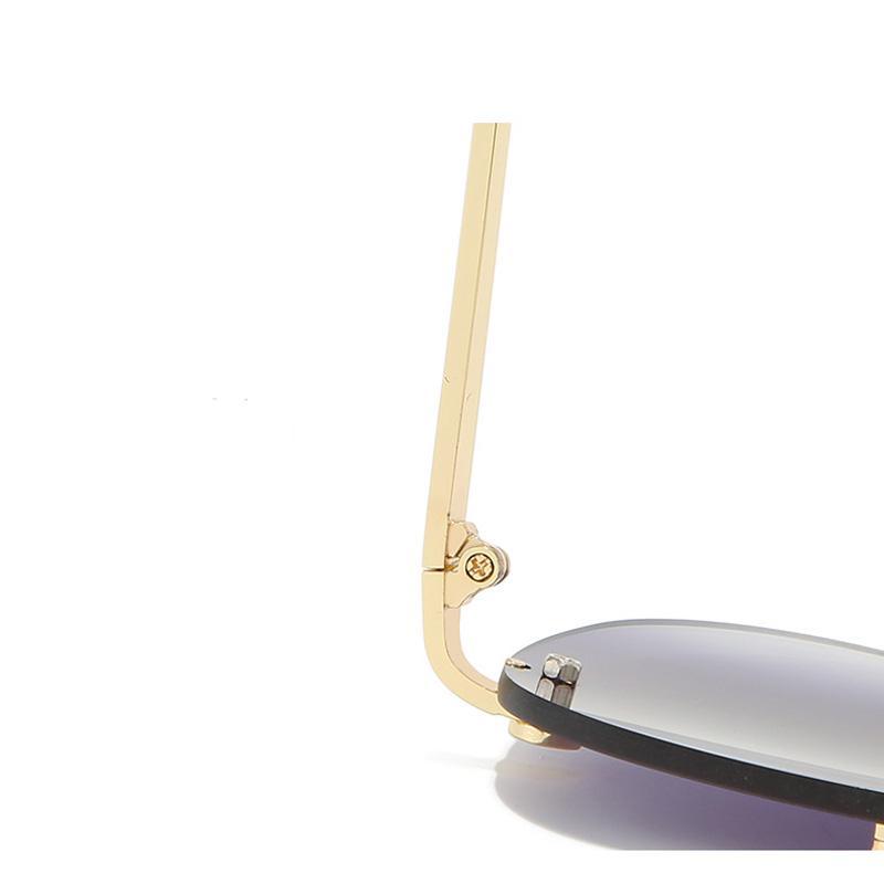Stevvex metal rimless UV-protected gradient sunglasses with sleek frames and tinted lenses for stylish sun protection.