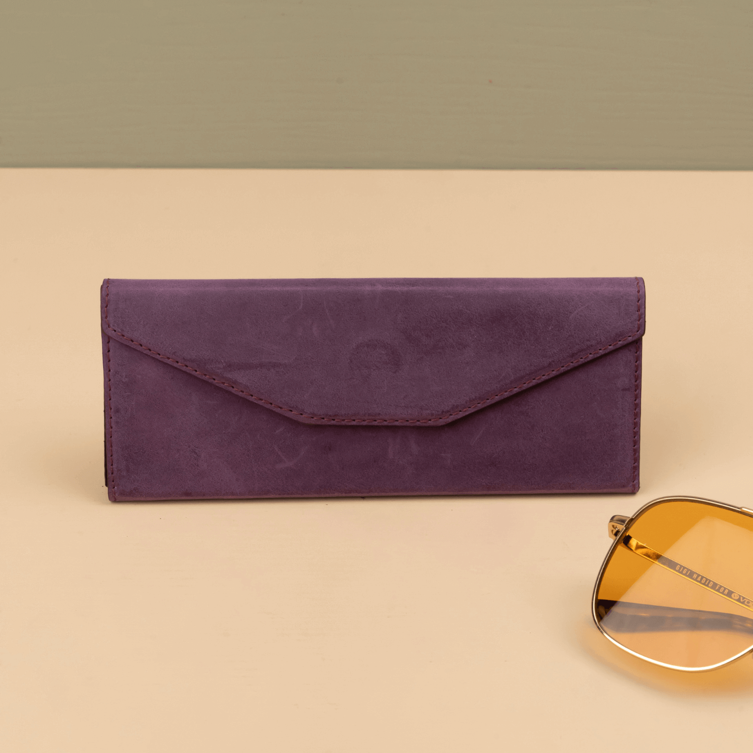 Purple luxury leather sunglasses case by LEATHERE, designed to protect eyewear in a stylish, high-quality accessory.