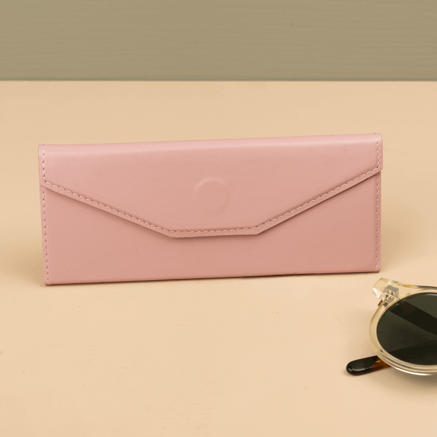 Pink leather sunglasses case from LEATHERE, a stylish eyewear accessory with a sleek, protective design for luxury sunglasses.