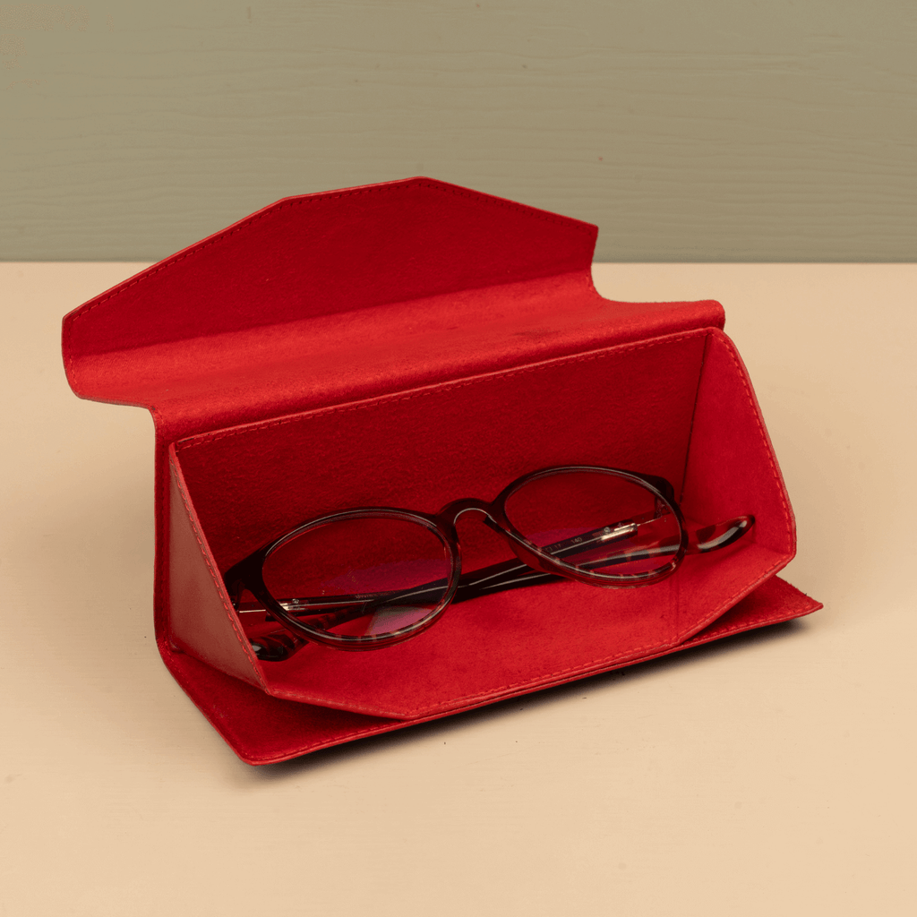 Red luxury leather sunglasses case from LEATHERE, stylish eyewear accessory with soft interior for protection.