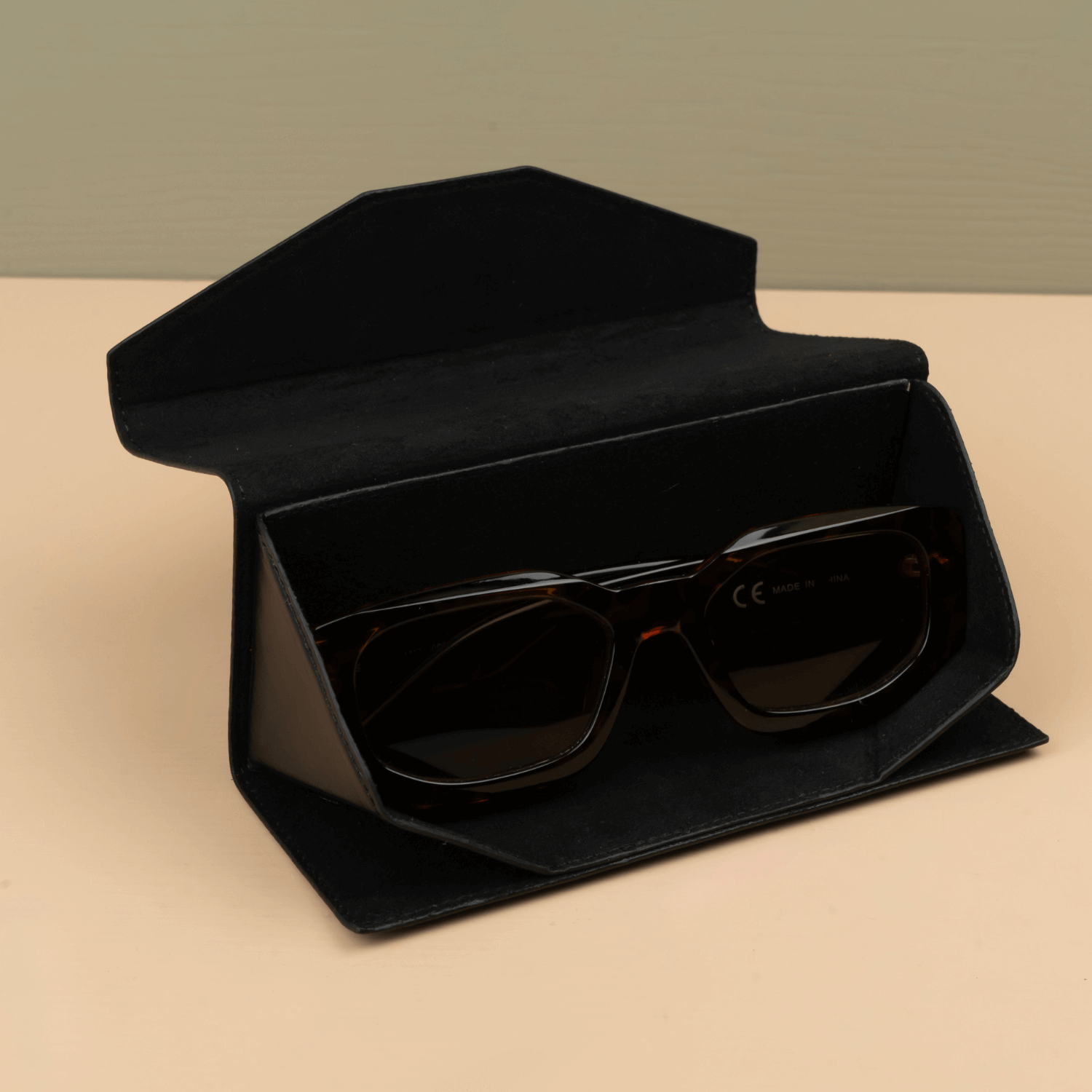 Black leather sunglasses case by LEATHERE, stylish eyewear accessory with soft interior for protection and storage of sunglasses.