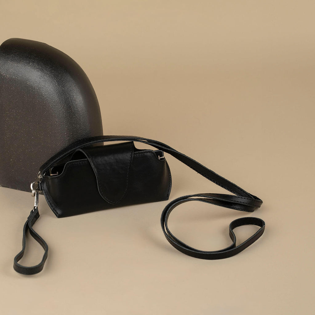 Black leather sunglass case with wrist strap by LEATHERE, designed for eyewear protection and easy carrying.