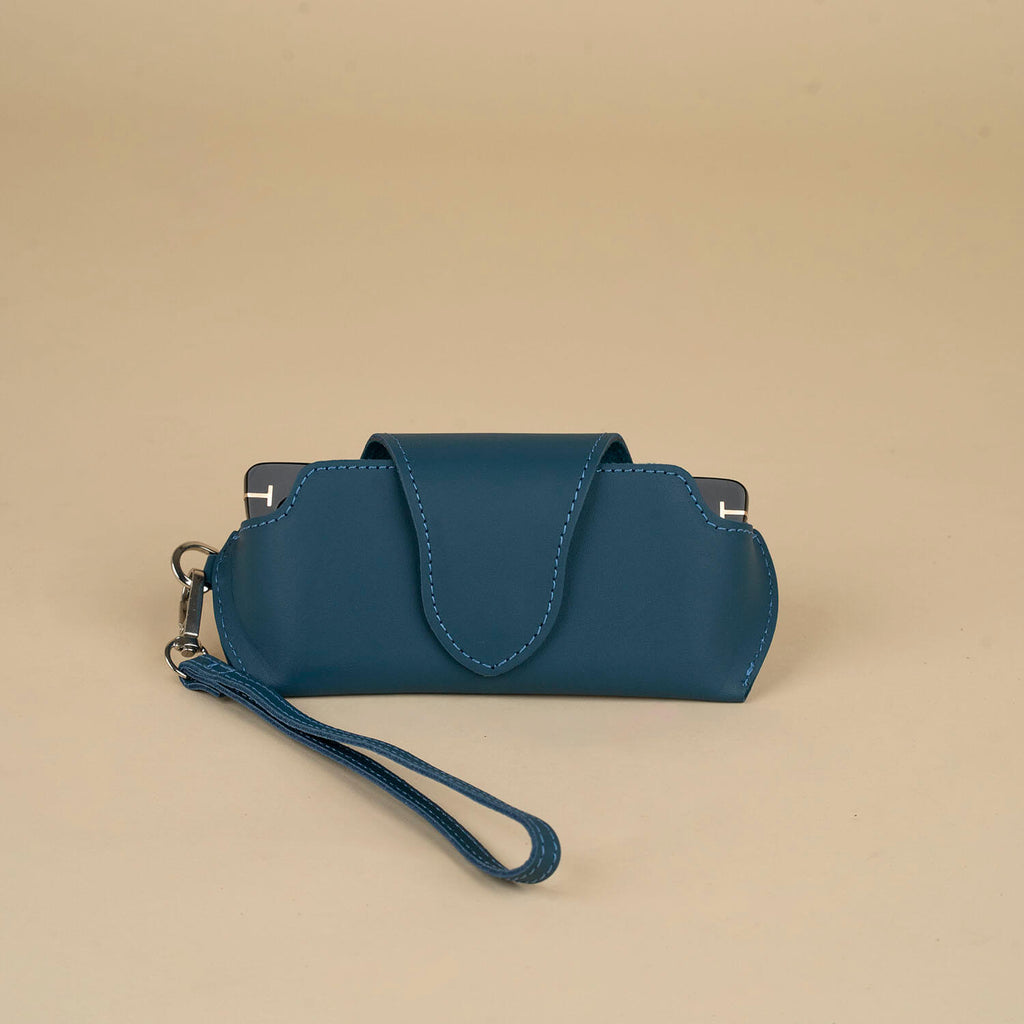 Navy blue leather sunglass case with wrist strap by LEATHERE, designed for eyewear protection and easy carrying.