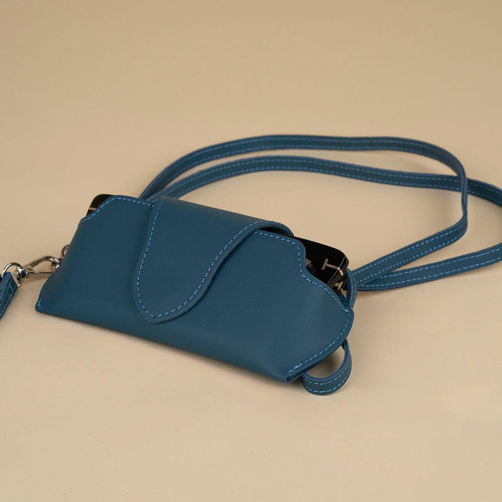 Leather navy blue sunglass case with wrist strap by LEATHERE, designed for eyewear accessories and protection.