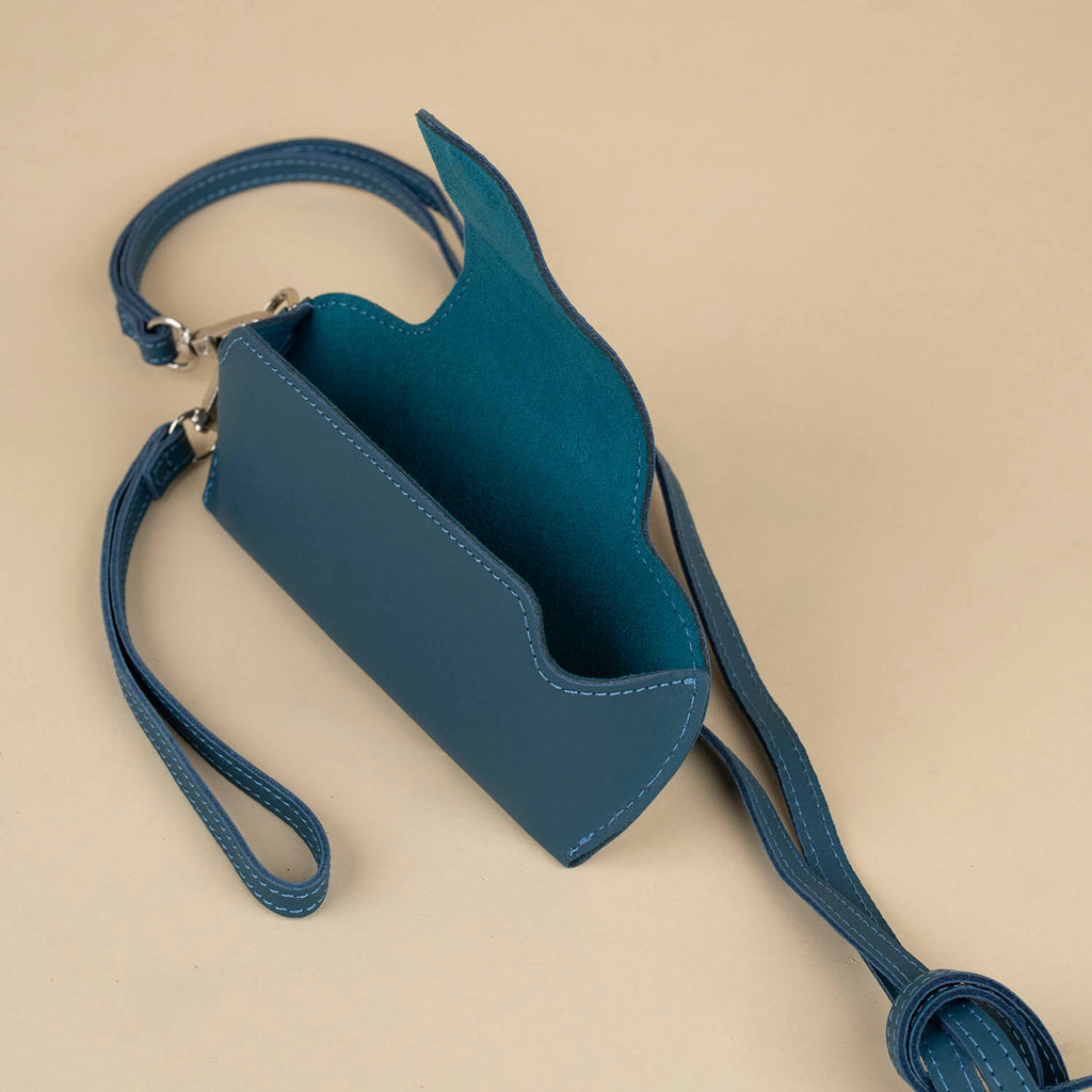 Leather navy blue sunglass case with wrist strap from LEATHERE, designed for eyewear protection and easy carrying